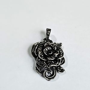 Silver tone rose pendant with black crystals